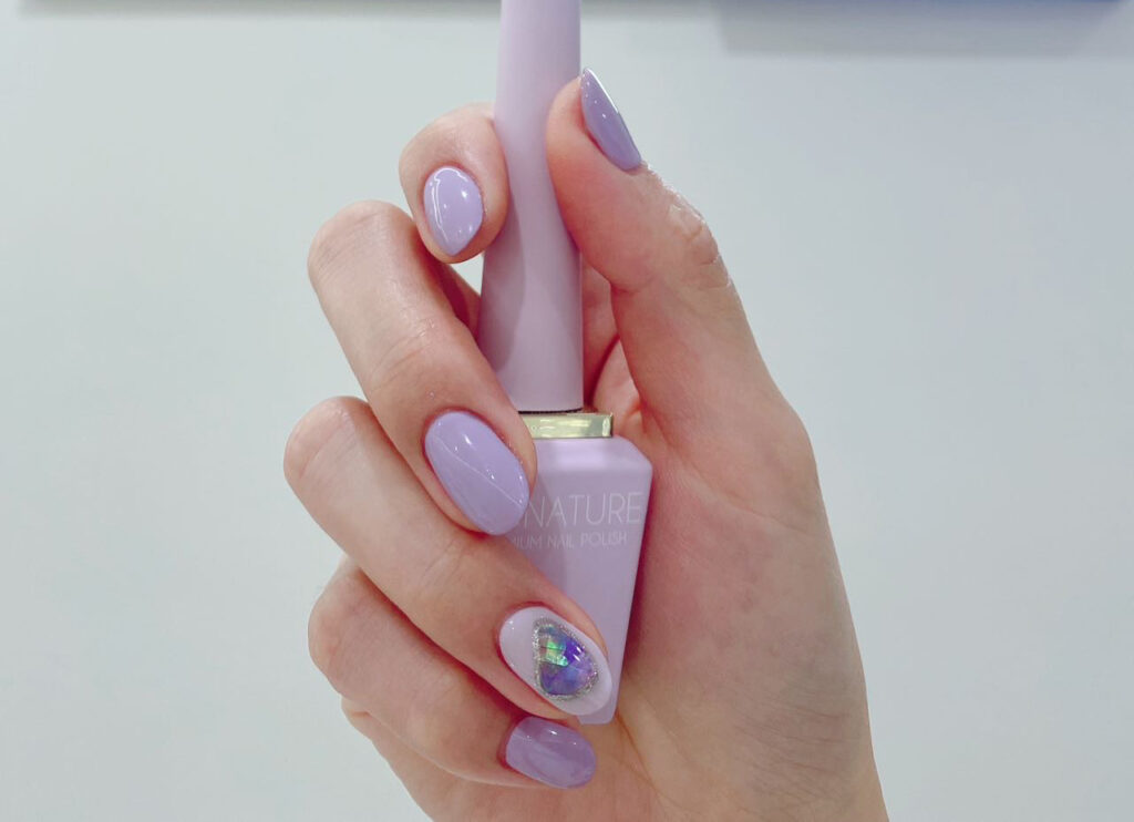 Lavender gel manicure with gem accent